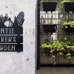 Custom veggie garden metal sign on a wall