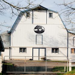 Personalized Farm Metal Name Sign on a white barn