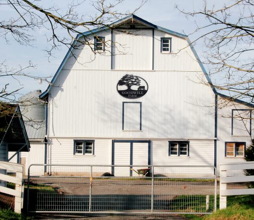 Personalized Farm Metal Name Sign on a white barn